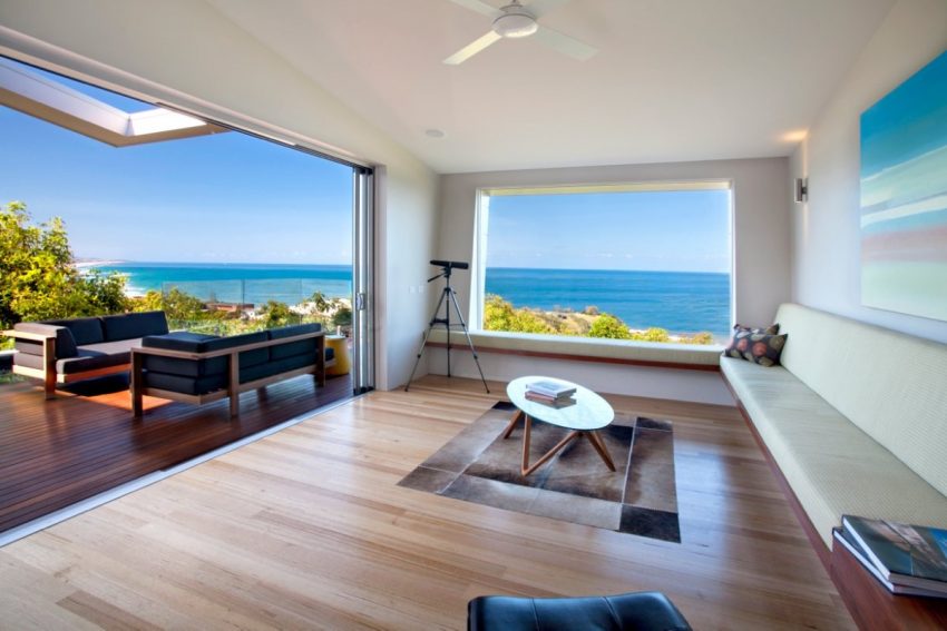 Architecture Beach Pictures Design Ideas Wooden Laminated Floor Wooden Furniture Big Glass Window Amazing View On Beach House Interior Design With An Open Air And A Set Of Chair Outside The Home Beach View in Home Architecture - The Perfect Investment Home