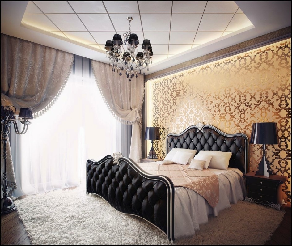 Classic Bedroom Design Which Contain A Double Bed With Black Leather Headboard Alongside Lamps Above Wooden Drawers Designated Light Yellow Wall With Gold Ornament Bedroom