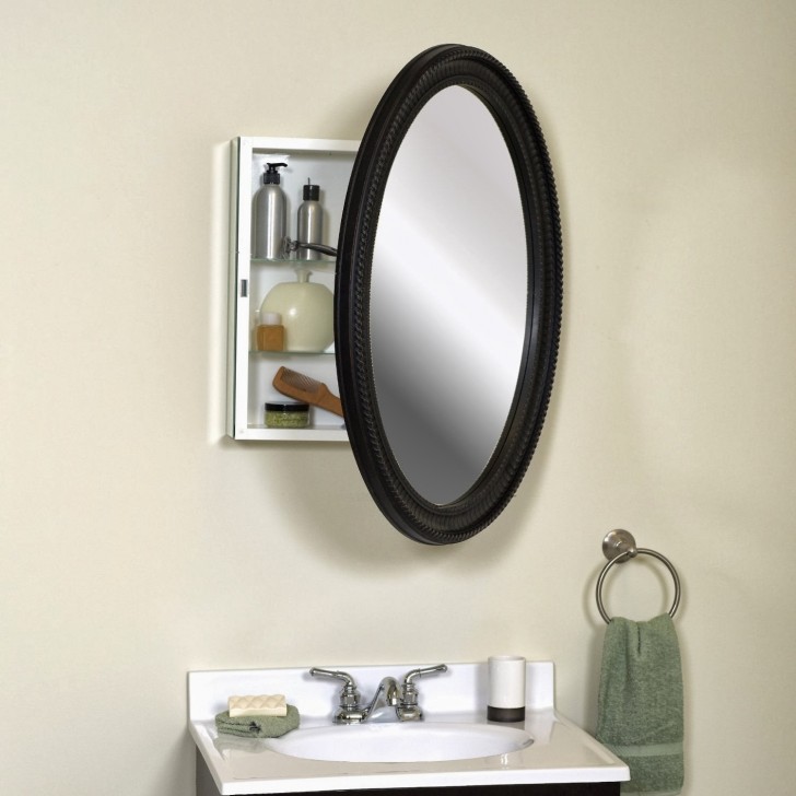 Bathroom Furniture Rectangular White Wooden Medicine Cabinets And Oval Mirror Door With Black Wooden Frame On White Wall Plus Round Steel Towel Hook And White Washbasin Modern Ideas Of Medicine Cabinets Choose Oval Mirrors for Your Bathroom