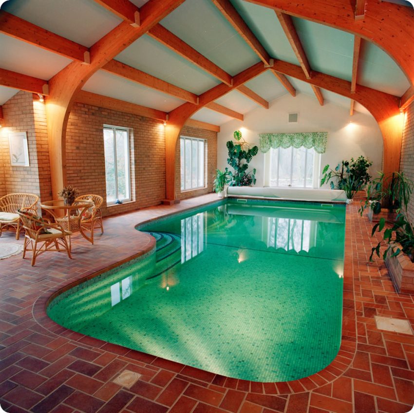 Pool Design Lovely Indoor Swimming Pool Design Ideas With Wooden Ceiling Pure Water Stained Flooring Window Lighting Sitting Space Several Plants And Amazing Wall Design The Important Part of Indoor Swimming Pools