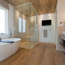 Bathroom Thumbnail size Modern Bathroom Ideas With White Bath TubWooden Laminated Floor Wooden Ceiling Simple Lighting With Two Window Glass Door Bath Tv Screen And Storage