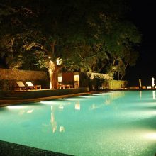 Pool Design Glamours Large Swimming Pool Ideas With LED Lighting Luxury Resort Sitting Area Chair And Table Plants Stone Floor Tile And Star Concept Night Ideas Luxury Swimming Pool Lights Design