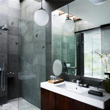 Bathroom Thumbnail size Amazing Ball Hanging Lamps Over White Concrete Sink White Top Feat Wide Wall Mount Mirror As Well As Gray Granite Wall Panels In Modern Gray Hotel Bathroom Decors Soothing Hotel Bathroom