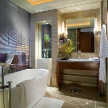 Bathroom Thumbnail size Contemporary White Porcelain Free Stas Well Asing Tub Escorted By Wooden Vanity Mirror As Well As Ceiling Lighting Decors In Modern Hotel Bathroom Views Soothing Hotel Bathroom Scheme Furniture