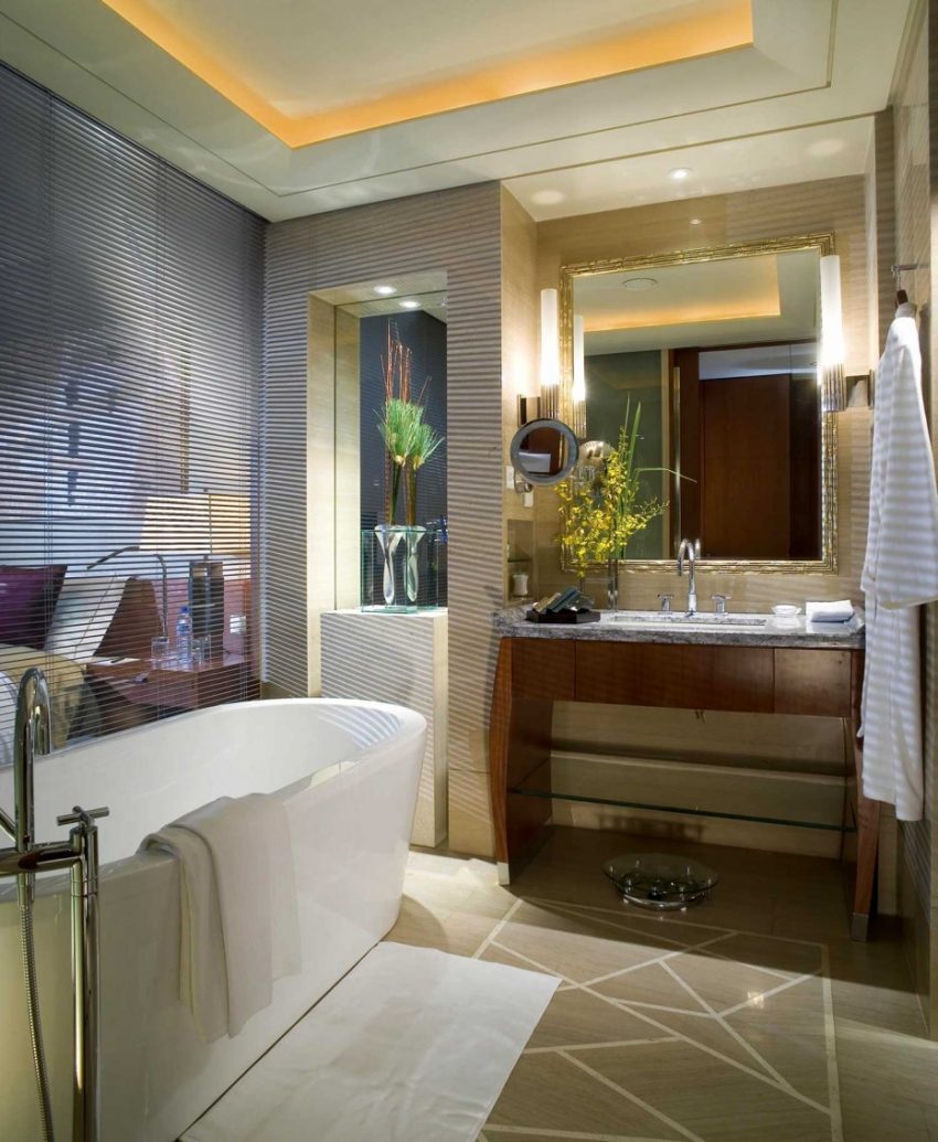 Bathroom Contemporary White Porcelain Free Stas Well Asing Tub Escorted By Wooden Vanity Mirror As Well As Ceiling Lighting Decors In Modern Hotel Bathroom Views Soothing Hotel Bathroom Scheme Furniture Minimalist Bathroom Designs - What Are The Options?
