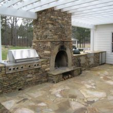 Kitchen Thumbnail size Creative Outdoor Kitchen Backyard Concept Design Simple Fireplace Brick Stone Material Traditional Stone Flooring Ideas Simple Stove Green Plants Ideas Outdoor Kitchen With White Paint Home