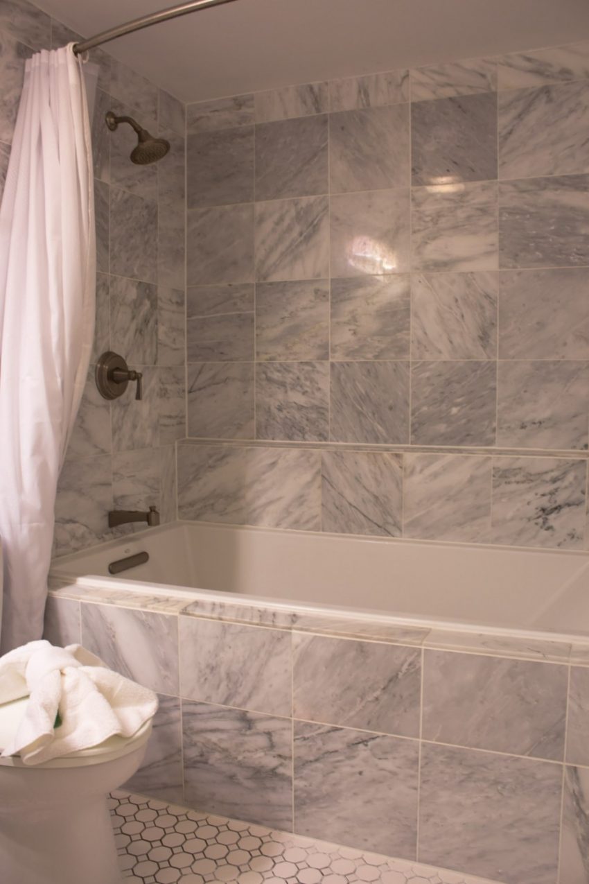 Bathroom Enjoyable Gray Marble Subway Tile Wall Panelling Bath Escorted By White Rectangular Bathtub As Well As Burnished Bronze Wall Mount Shower Tub Combo Faucet As Well As White Shower Curtain In Vintage Sorts of Decorating Design of Bathroom