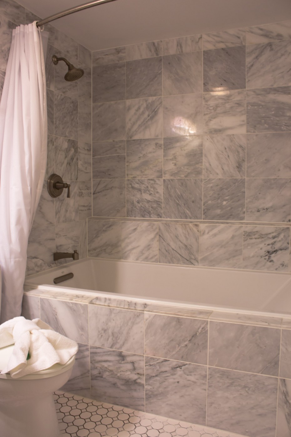 Enjoyable Gray Marble Subway Tile Wall Panelling Bath Escorted By White Rectangular Bathtub As Well As Burnished Bronze Wall Mount Shower Tub Combo Faucet As Well As White Shower Curtain In Vintage Bathroom