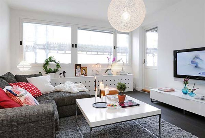 Apartment Gorgeous Decorating Living Room Ideas For Small Apartment With Gray Sofa And Rug Simple White Table And Candle Light Book And Flower On Table Picture And L Shaped Table Window Chandelier And Tv Screen Ideas Gorgeous Small Apartment Design