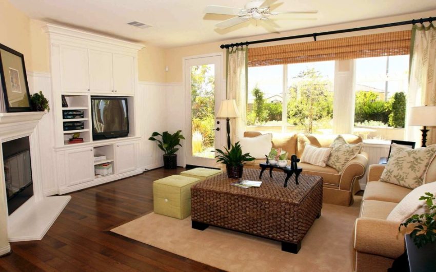 Living Room Medium size Modern Apartment Living Room Style And Standing Lamp Brown Rattan Coffee Table With Wooden Flooring And Cream Carpet Flooring And Small Fire Pit And Cushion With Glass Window With Comfortable Sofa