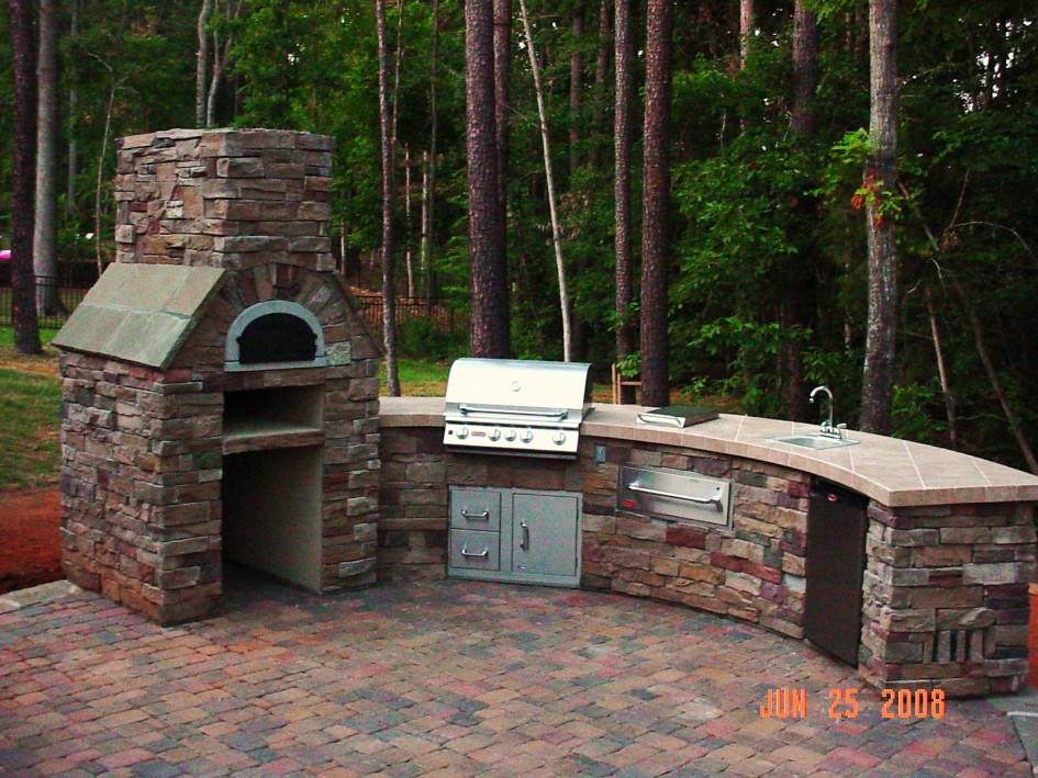 Rustic Stones Outdoor Pizza Oven Also Concrete Top Escorted By Single Washbasin In Backyard Las Well Asascaping Plan Amazing Outdoor Exterior Kitchen Exciting Round Outdoor Kitchen Kitchen