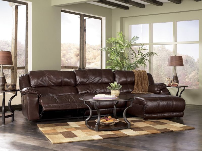 Vintage Style For Multi Sofa Color Brown Leather Sofa Small Cooffe Table Vase And Books Fur Rug Classic Flooring Ideas Two Lamp Small Table Several Glass Window Ceiling And Wall Paint Living Room