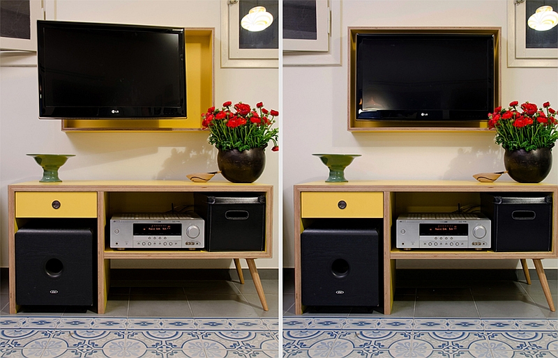 Apartment Compact Storage Entertainment Design With Yellow Recessed TV Slot Above Standing Cabinet With Drawer Tell Aviv Apartment Shines with Colorful Renovation Dressed in Old World Charm