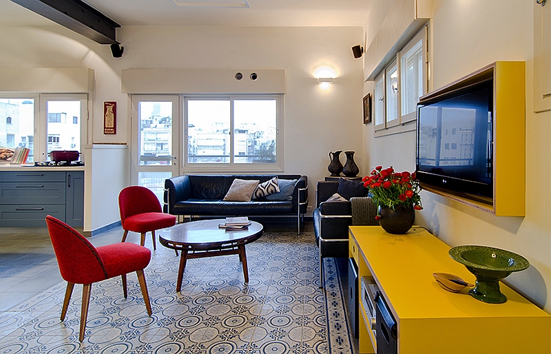 Apartment Flashing Red Chair Design Facing Round Coffee Table Before Yellow Cabinetry With Floating TV Set Tell Aviv Apartment Shines with Colorful Renovation Dressed in Old World Charm