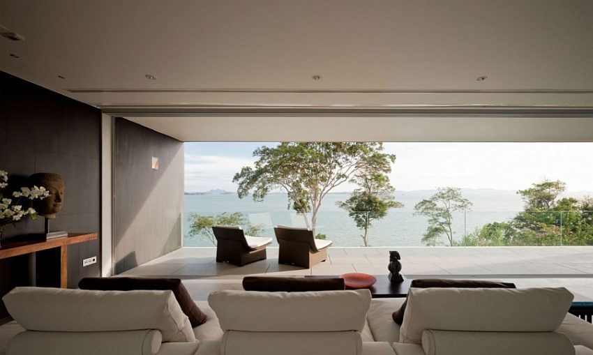 Villa & Resort Coastal Private Balcony Facing Panoramic View With Two Relaxing Chairs Before Luxurious Living Room Tasting Modern and Nature Master Piece in Phuket by Serenity Home