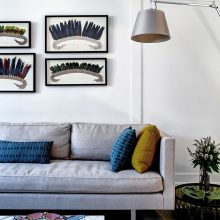 Apartment Thumbnail size Comfortable Simple Living Space With Grey Sofa Design Flashing Blue Yellow Cushions Beneath Sloping Floor Lamp