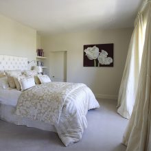 Bedroom Dazzling Modern Feminine Bedroom With Black Tufted Headboard Covered With White Blanket Beneath Abstract Painting Lovable Bedroom Designs that Exude Feminine Character
