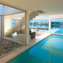 Architecture Thumbnail size Extended Outdoor Indoor Pool Design Beneath Staircase With Pebble Deck Idea And Wondrous Living Space