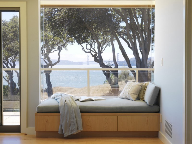 Grey Reading Nook Idea Upon Brown Wooden Storage Beneath Gassy Window Aside Framed Sliding Door Villa & Resort