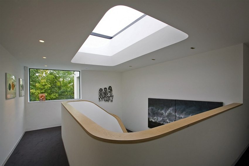 Interior Design Medium size Luxurious Urban Skylight Above Spiral Staircase Featuring Recessed Lighting Above Black Floor