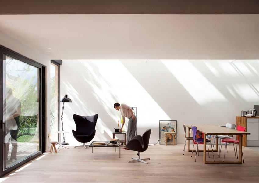 Interior Design Mesmerizing Black Relaxing Chair Aside Floor Lamp Upon Wooden Floor Below Framed Large Window Design Amazing Eco Friendly Prefabricated Modular House in Paris