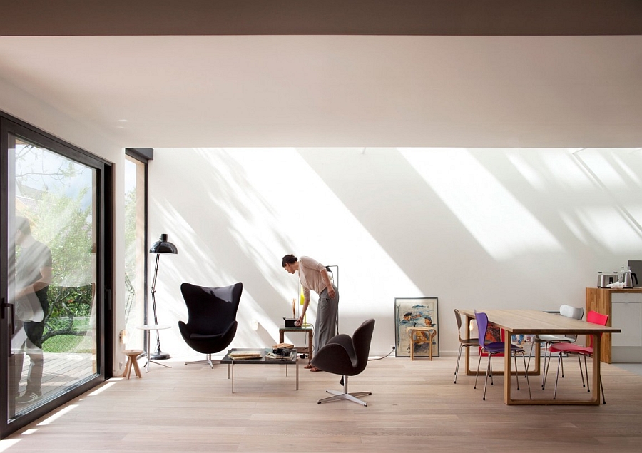 Mesmerizing Black Relaxing Chair Aside Floor Lamp Upon Wooden Floor Below Framed Large Window Design Interior Design