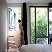 Interior Design Mesmerizing Black Relaxing Chair Aside Floor Lamp Upon Wooden Floor Below Framed Large Window Design Amazing Eco Friendly Prefabricated Modular House in Paris