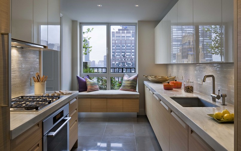 Modern Kitchen Design With Tan Cabinetry System Splashed With Wooden Backsplash And Cozy Reading Nook Villa & Resort