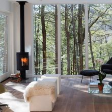 Living Room Thumbnail size Open Spacious Living Space Design With Black And Green Reclining Chairs Design Facing White Bench And Small Freestanding Fireplace