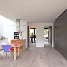 Interior Design Mesmerizing Black Relaxing Chair Aside Floor Lamp Upon Wooden Floor Below Framed Large Window Design Amazing Eco Friendly Prefabricated Modular House in Paris