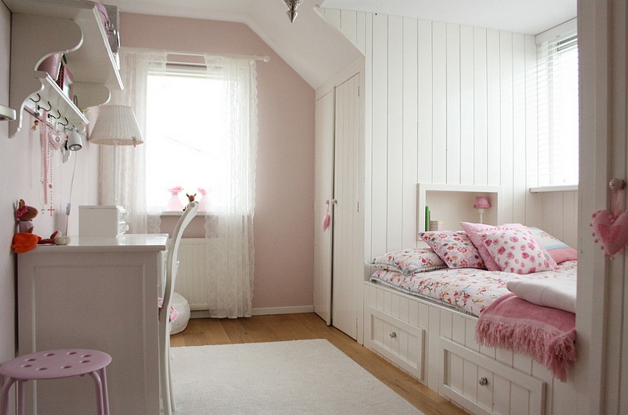 Storage Bed Design With Floral Pink Patterned Bedcover Beneath Small Window Facing White Vanity Bedroom