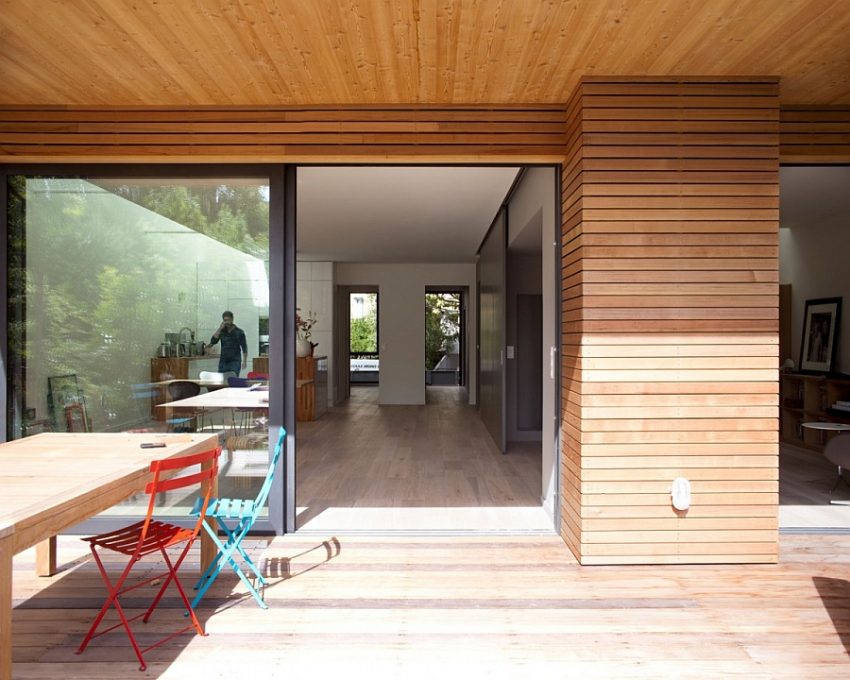 Interior Design Medium size Terrace Family Hub With Blue Red Chair Design Facing Wooden Table Flashed With Deck Walling Idea