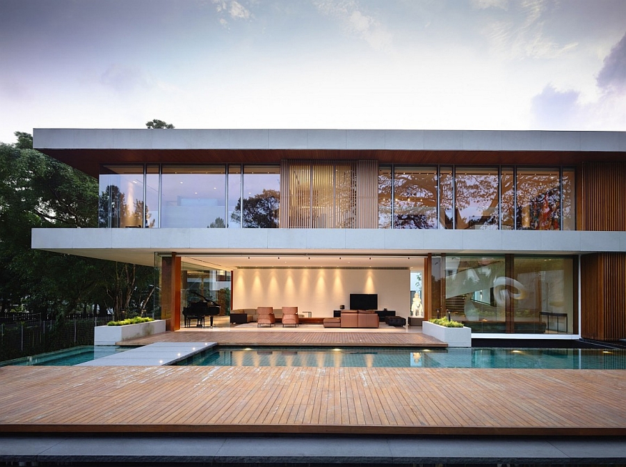 Two Story Home Design With Glassy Window Overlooking Outdoor Pool Design Reflecting Blue Sky Architecture