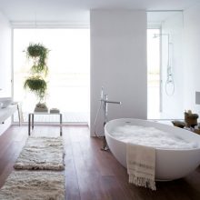 Bathroom White Egg Shaped Bathtub Wooden Floor White Wall Fur Carpet black-bathtub-egg-shaped-white-floor-large-glass-windows