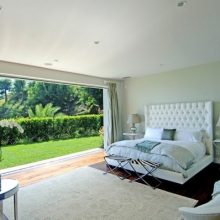Bedroom Big Glas Window Luxurious Style Bed Big White Chair White Rugs Big-glass-window-wooden-floor-Modern-lamp-picture