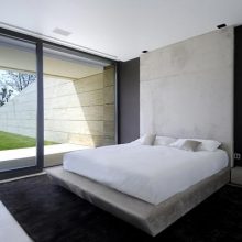 Bedroom Big Glass Window Black Rugs Plain White Bed Cover Modern Style Bed Big-glas-window-Luxurious-style-bed-Big-white-chair-White-rugs