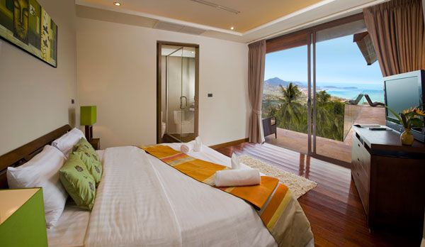 Bedroom Big Glass Windows LCD TV Big Mirror Green Stand Lamp Bedrooms to Support Amazing Beach View