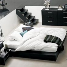 Bedroom Elegant Low Profile Bed Black Bedside Table Glossy Dark Artistic Painting Glass-wall-White-fur-rug-Wooden-bed-frame-Inspiring-ball-light